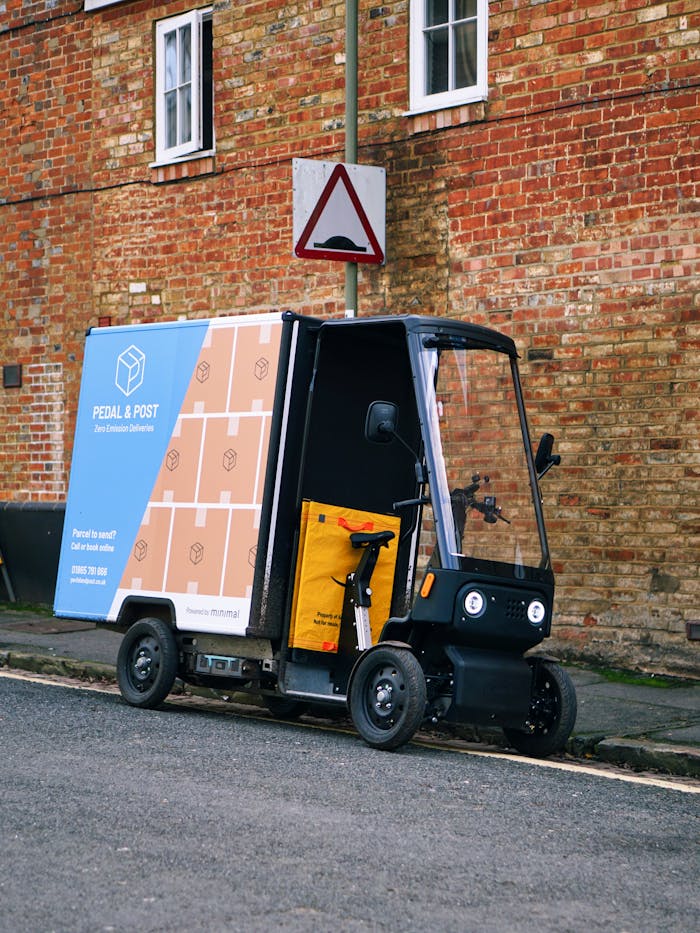 services-06 Eco-friendly delivery vehicle parked on a street in Oxford, England.